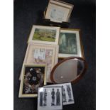 An antique mahogany oval bevelled mirror together with a large quantity of assorted framed pictures
