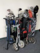 Four golf bags containing assorted irons and drivers to include Dunlop, Howson, Donnay etc,