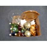 A box containing assorted glass bottles, cafetieres, shells,