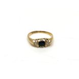 An 18ct gold sapphire and diamond ring, size N. CONDITION REPORT: 1.