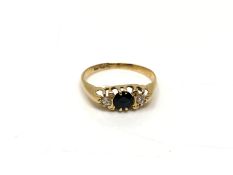 An 18ct gold sapphire and diamond ring, size N. CONDITION REPORT: 1.