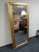 A contemporary gilt framed bevel edged hall mirror