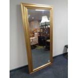 A contemporary gilt framed bevel edged hall mirror