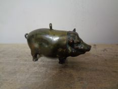 An antique vesta in the form of a pig