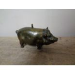 An antique vesta in the form of a pig