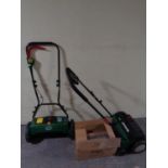 Three boxed Cooper's lawn aerators together with a Qualcast lawn mower and aerator (a/f)