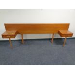 A mid 20th century teak continental headboard