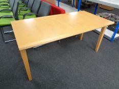 A contemporary architect's table in a pine finish