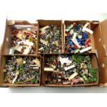 A box of a large quantity of miniature plastic soldiers and figures