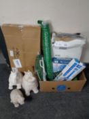 A box of new gardening equipment to include coil hose, water cannon, fish pond protector,