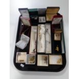 A tray of a quantity of costume jewellery to include marcasite earrings, pendants on chains,