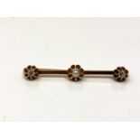 A 9ct gold diamond and pearl bar brooch CONDITION REPORT: 4.