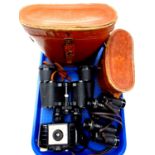 A tray of two pairs of leather cased binoculars by Silraft and Viper,