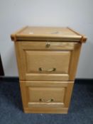 A contemporary two drawer filing chest with key