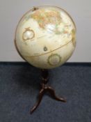 A Replogle globe on stand