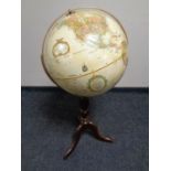 A Replogle globe on stand