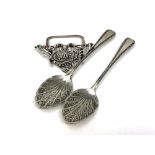 A pair of Victorian silver jam spoons and an ornate silver menu stand (3)