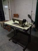 A Brother industrial treadle sewing machine in table