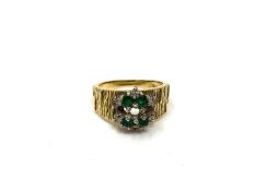 An 18ct gold emerald and diamond cluster ring, size M, (stones missing).