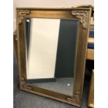 An ornate bevelled mirror,