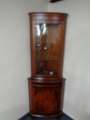 A mahogany glazed door corner display cabinet,