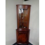 A mahogany glazed door corner display cabinet,