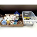 A box of assorted china to include commemorative ware, dressing table brushes, harmonica with book,