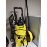 A Karcher K4 pressure washer with accessories