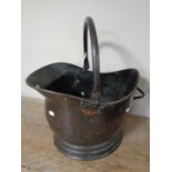 A 19th century copper coal bucket