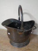 A 19th century copper coal bucket