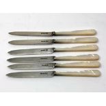 Six silver bladed table knifes with mother of pearl handles
