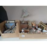 Two boxes of miscellany to include continental figures, wall plates, figural table lamp, tea china,
