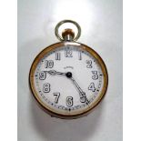 A large plated cased eight day pocket watch