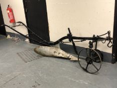 An antique Lincolnshire cast iron plough