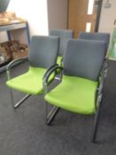 A set of four Ahrend tubular metal and two tone fabric upholstered office armchairs