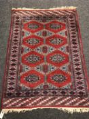 A Bukhara rug on red ground,