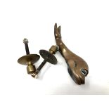 A bronze dolphin door knocker and striking plate.