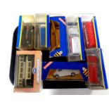 A tray containing 10 boxed Corgi die cast vehicles to include trams,