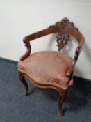 A 19th century mahogany elbow chair on cabriole legs