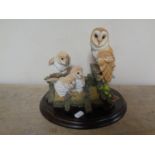 A Royal Doulton sculpture of a barn owl family,
