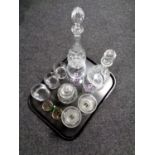 A tray containing two lead crystal decanters with stoppers together with assorted drinking glasses,
