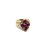 A 9ct gold cabochon ruby cluster ring, size N.