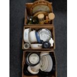 Three boxes containing assorted dinner plates and bowls, kitchen storage jars,