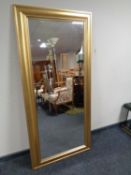 A contemporary gilt framed bevel edged hall mirror