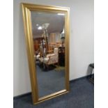 A contemporary gilt framed bevel edged hall mirror