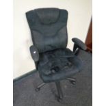 A swivel office armchair upholstered in a black fabric