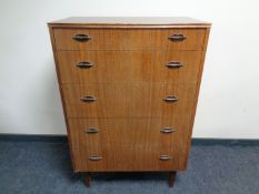 A mid 20th century teak five drawer chest