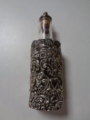 An antique glass and filigree silver scent bottle