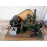 A vintage key cutting machine
