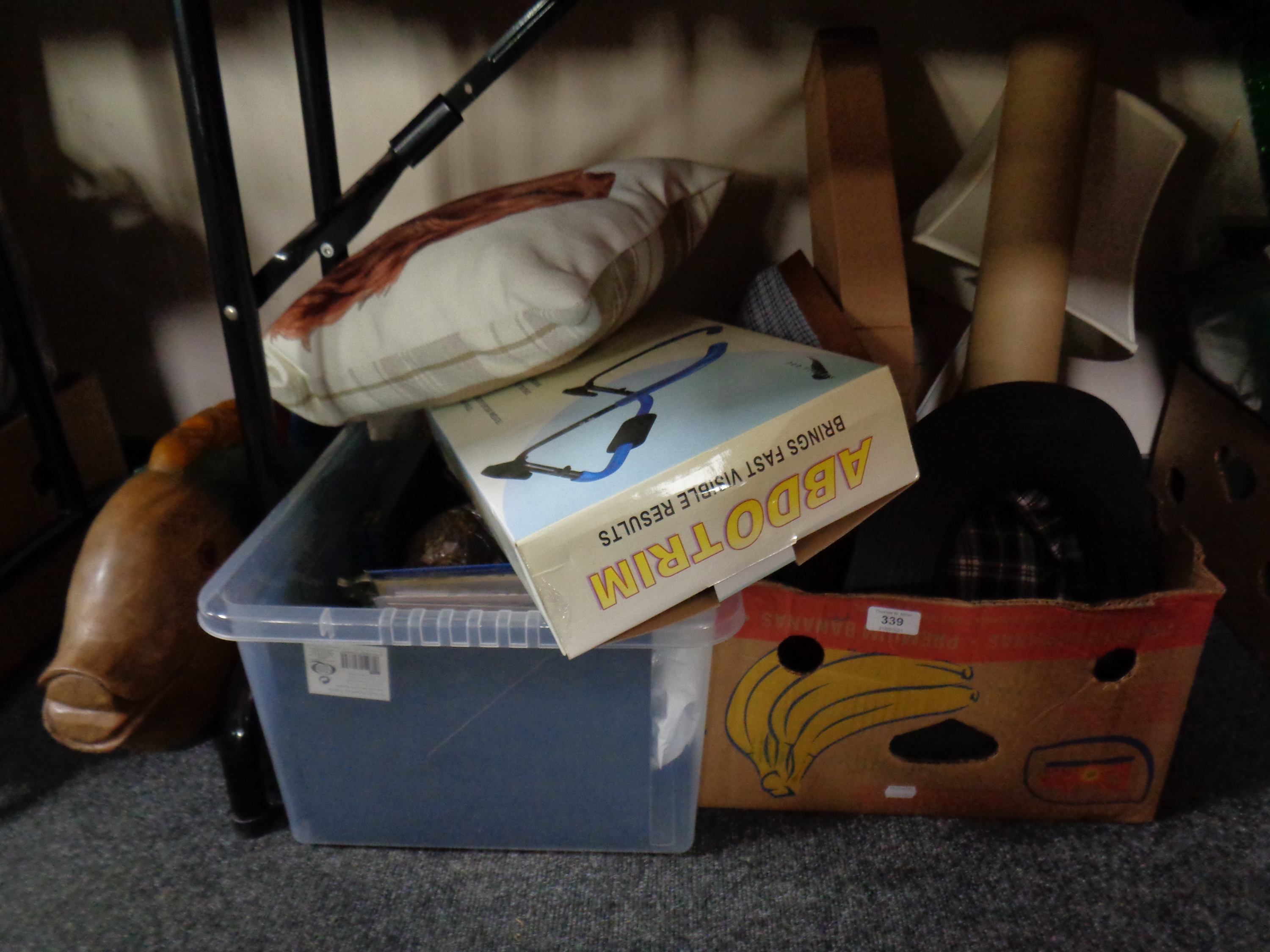 A box and a crate of miscellany to include picture frames, cushions, flask, flexi light, lap tray,